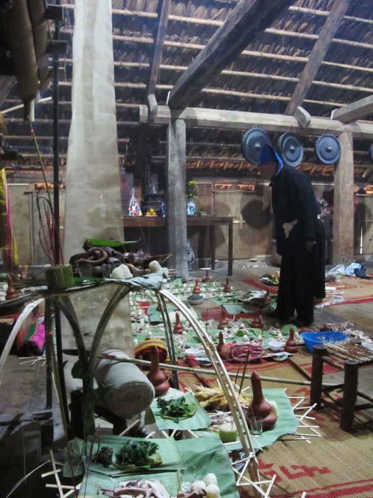 A Muong shaman is hosting a ceremonial worshiping